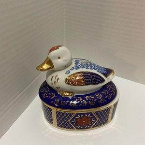 Adorable cobalt blue and multicolored duck trinket box.